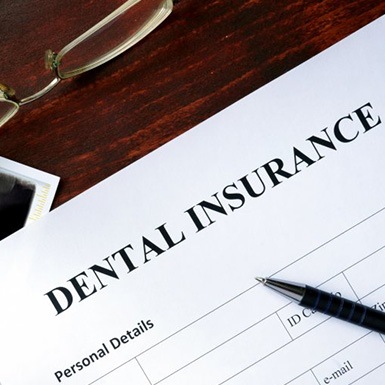 a dental insurance form next to an X-ray image