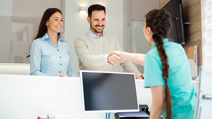 Couple meeting a receptionist