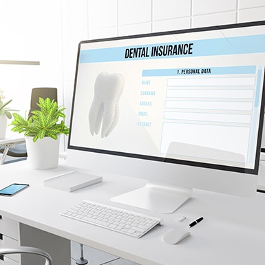 Dental insurance form displayed on large computer monitor