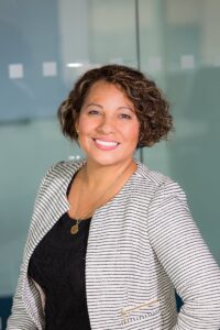 Smiling middle-aged woman in business office